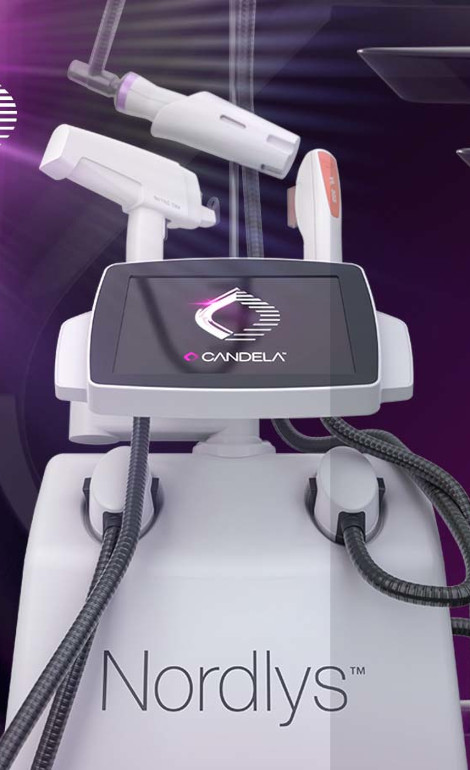 En Nordlys lasermaskin från Candela med skärm och flera fästen mot mörk bakgrund.